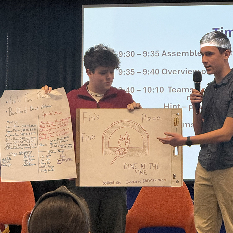 Students presenting a pizza business idea